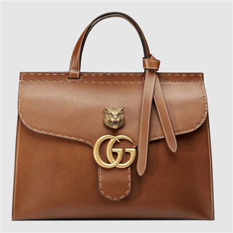 brown leather gucci handbag stamped gucci made in italy|Gucci brown suede bag.